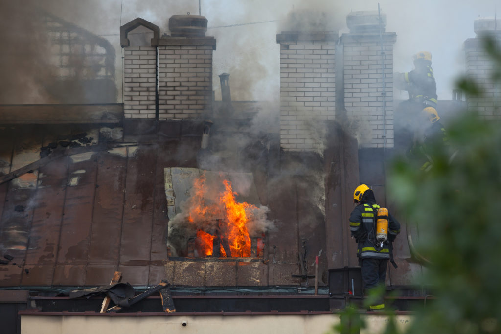 Washington firemen putting  a chimney fire out